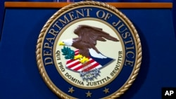 FILE - The Justice Department seal is seen in Washington, Nov. 28, 2018.