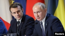 俄罗斯总统普京与法国总统马克龙。（路透社2019年12月9日）