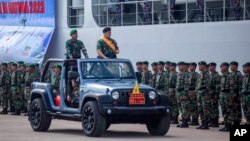 Indonesian Armed Forces Chief Adm. Yudo Margono inspect the troops during the opening ceremony of ASEAN Solidarity Exercise at Batu Ampar Port on Batam island, Indonesia, Tuesday, Sept. 19, 2023. (AP Photo/Andaru Kz)