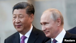 资料照片：中国国家主席习近平和俄罗斯总统普京。（2019年6月5日）