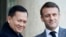 FILE — French President Emmanuel Macron, right, winks as he welcomes Cambodia's Prime Minister Hun Manet in Paris, Jan. 18, 2024. Hun Manet has enjoyed warming relations with the West during his first few months in power despite maintaining much of his father's hardline tactics.