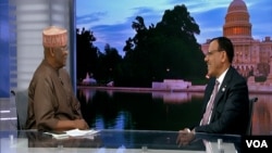 FILE - In this screengrab from video, Niger's President Mohamed Bazoum, right, sits for an interview with VOA Hausa Service chief Aliyu Mustapha at VOA headquarters in Washington, Dec. 13, 2022.