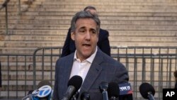 FILE - Michael Cohen speaks to reporters as he arrives for former President Donald Trump's civil business fraud trial at New York Supreme Court, Oct. 24, 2023.