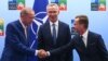 Turkey's President Recep Tayyip Erdogan, left, shakes hands with Sweden's Prime Minister Ulf Kristersson, right, as NATO Secretary General Jens Stoltenberg looks on prior to a meeting ahead of a NATO summit in Vilnius, Lithuania, July 10, 2023.