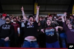 Supporters cheer as Republican presidential candidate and former President Donald Trump speaks at the National Rifle Association's Presidential Forum in Harrisburg, Pennsylvania, Feb. 9, 2024.