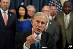 FILE - Texas Gov. Greg Abbott speaks after signing one of several bills at the Texas Capitol in Austin, Texas, June 6, 2023.