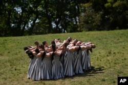 Performers take part in the final dress rehearsal of the flame lighting ceremony for the Paris Olympics, at the Ancient Olympia site, Greece, April 15, 2024.