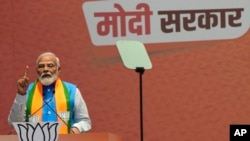 Indian Prime Minister Narendra Modi speaks during an event in which he released his ruling Bharatiya Janata Party's manifesto for the upcoming national parliamentary elections in New Delhi, India, April 14, 2024. 