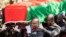 FILE - Pallbearers carry the coffin at the burial service for Malawi's Vice President Saulos Chilima in Nsipe, Malawi, June 17, 2024. 