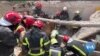 Searchers Dig for Bodies in Rubble of Lviv Apartment Complex 