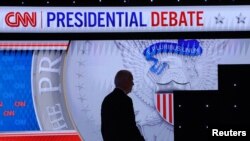 U.S. President Joe Biden walks during a break as he participates in a presidential debate in Atlanta, Georgia, June 27, 2024.