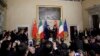 FILE - Chinese President Xi Jinping, background left, talks with then-Italian Prime Minister Giuseppe Conte during the signing of a memorandum of understanding in support of the Belt and Road Initiative, at Rome's Villa Madama, March 23, 2019.