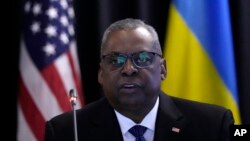 FILE - U.S. Defense Secretary Lloyd Austin delivers his speech during the opening of the meeting of the Ukraine Defense Contact Group at Ramstein Air Base, in Ramstein, Germany, April 21, 2023. 