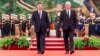 FILE - Chinese President Xi Jinping and Cuba's President Miguel Diaz-Canel Bermudez walk during a welcome ceremony in Beijing, Nov. 25, 2022. They pledged mutual support over their fellow communist states' "core interests."