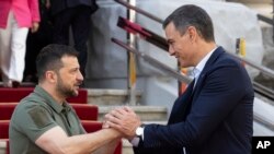 Photo from Ukrainian Presidential Press Office. Ukrainian President Volodymyr Zelenskyy, left, and Spain's Prime Minister Pedro Sanchez shake hands in Kyiv, Ukraine, July 1, 2023.