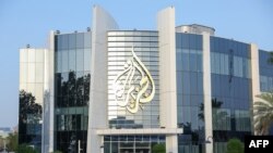 FILE - The main headquarters of Qatari news broadcaster Al Jazeera is seen in the capital, Doha, on May 6, 2024. 
