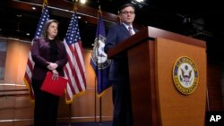 FILE - Republican House Speaker Mike Johnson speaks during a press conference on Capitol Hill, in Washington, Jan. 30, 2024. At left is Rep. Elise Stefanik.