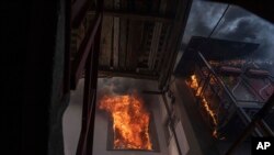 A house on fire after a Russian shelling, in a residential neighborhood, in Kherson, Ukraine, July 1, 2023.