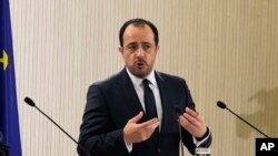 FILE - Cyprus' President Nikos Christodoulides speaks in Nicosia, Cyprus, Feb. 12, 2024. This month, he said the EU won't serve its best interests if it doesn't consider designating parts of Syria as safe zones so refugees and migrants can return there.