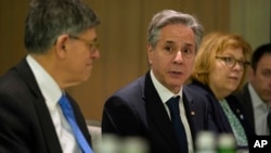 FILE - U.S. Secretary of State Antony Blinken, center, meets with former Israel Defense Forces chief Gadi Eisenkot and former Israeli Defense Minister Benny Gantz in Tel Aviv, Feb. 8, 2024. Blinken will return to the Middle East June 9 to push for acceptance of a cease-fire pact.