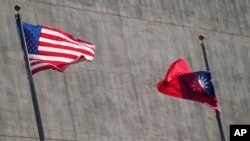 FILE - A U.S. and a Taiwanese flag flutter outside a hotel as Taiwan's president was staying in Los Angeles, California, April 4, 2023. Taiwan will be among the participants of the Asia-Pacific Economic Cooperation forum in San Francisco this week.