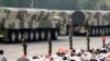 FILE - Military vehicles carrying intercontinental ballistic missiles travel past Tiananmen Square during the military parade marking the 70th founding anniversary of People's Republic of China, in Beijing, Oct. 1, 2019.