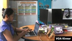 Mao Map, Executive Director of Klahaan, an independent organization that campaigns for women’s rights in Cambodia, works in her Phnom Penh office