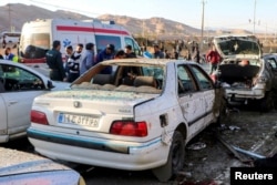 FILE - People gather at the scene of explosions during a ceremony held to mark the death of late Iranian General Qassem Soleimani, in Kerman, Iran, Jan. 3, 2024. (West Asia News Agency via Reuters)