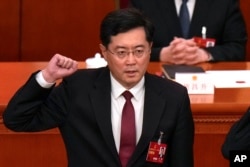 FILE - Then-newly elected Chinese Foreign Minister Qin Gang takes his oath at the Great Hall of the People in Beijing on March 12, 2023. China on July 25, 2023 removed Qin from office and replaced him with his predecessor, Wang Yi.