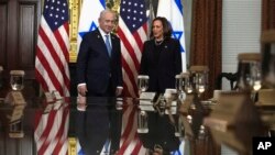 Vice President Kamala Harris, right, and Israeli Prime Minister Benjamin Netanyahu appear before a meeting at the Eisenhower Executive Office Building in Washington, July 25, 2024.