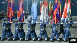 FILE - Myanmar junta military soldiers parade during a ceremony to mark the country's Armed Forces Day in Naypyidaw on March 27, 2024.