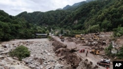 An aerial photo shows the aftermath of a mudslide on the outskirts of Xi'an, China, on Aug. 12, 2023. (Xinhua News Agency via AP)