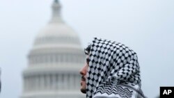 A man wearing a keffiyeh attends a pro-Palestinian rally near the U.S. Capitol in Washington, May 18, 2024.