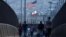 FILE - Pedestrians walk across a footbridge near the border crossing between Mexico and the United States at the San Ysidro border in San Diego, California, U.S., May 29, 2024. 