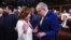 FILE - Then-House Speaker Nancy Pelosi, left, and Senate Majority Leader Chuck Schumer speak before President Joe Biden delivers the State of the Union address to a joint session of Congress at the Capitol, March 7, 2024, in Washington. 