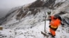 A worker installs surveying equipment in Denali National Park, Alaska, on September 21, 2022. 