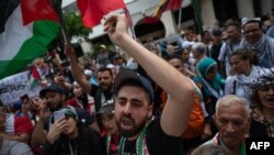 A man shouts slogans during a protest against Israel's military offensive in the Gaza Strip in front of the United Nations Program for Development office in Caracas, Venzuela, Oct. 21, 2023.