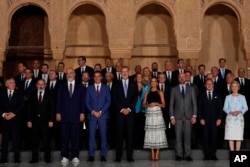 Spain's King Felipe VI, center, and Queen Letizia, center right, stand with leaders from across the continent at the Alhambra Palace during the European Political Community summit in Granada, Spain, Oct. 5, 2023.