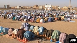 Muslim devotees offer Eid al-Fitr prayers, which marks the end of the holy fasting month of Ramadan at the Guzargah mosque in Herat, Afghanistan, April 10, 2024.