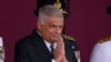FILE - Sri Lankan President Ranil Wickremesinghe greets a group of school children during the 76th Independence Day commemoration ceremony of Sri Lanka in Colombo, Sri Lanka, on Feb. 4, 2024. 