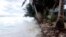 FILE - Waves surge over the beck and onto the island during a king tide event on Kili in the Marshall Islands, Jan. 21, 2015. (Bikini Atoll Local Government) 