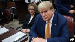 Former President Donald Trump sits in Manhattan Criminal Court, May 7, 2024, in New York.