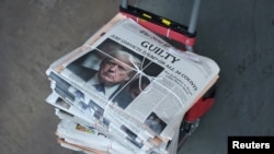 FILE - A copy of The New York Times featuring an image of former U.S. President Donald Trump is delivered the day after the verdict in his criminal trial over charges that he falsified business records, in New York City, May 31, 2024.