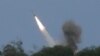 A U.S. M142 High Mobility Artillery Rocket System (HIMARS) fires a missile during a joint military exercise called "Balikatan," Tagalog for shoulder-to-shoulder in a Naval station in Zambales province, northern Philippines, April 26, 2023.