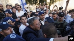 FILE - Israel's National Security Minister Itamar Ben-Gvir, center, attends a march marking Jerusalem Day, in front of the Damascus Gate of Jerusalem's Old City, May 18, 2023. 