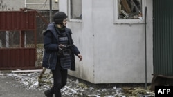 FILE - AFP journalist Arman Soldin walks in a village after a shelling on March 3, 2022, in Ukraine. Arman was killed by a rocket strike as he reported with AFP colleagues from Ukrainian positions in Chasiv Yar on May 9, 2023. 