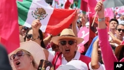 People participate in an opposition rally ahead of June 2 presidential elections, in Mexico City, Mexico, May 19, 2024.