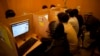FILE - People use the internet at a local cafe in Islamabad, Pakistan, March 7, 2012. Pakistan said July 26, 2024, that it is implementing an internet firewall, which critics and digital rights activists worry will be used to silence dissent.