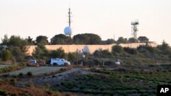 FILE - U.N. peacekeepers patrol on the Lebanese side of the Lebanese-Israeli border in the southern village of Bustan, July 12, 2023.