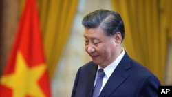 2023年12月13日，中国国家主席习近平在河内访问期间参加一场会谈。(美联社照片)